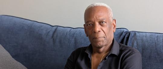 Resident sitting in flat