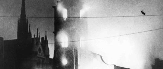 Black and white image of St Clement Danes Church ablaze 1941