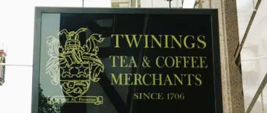 IImage of Twinings Tea Shop Sign gold lettering on black background